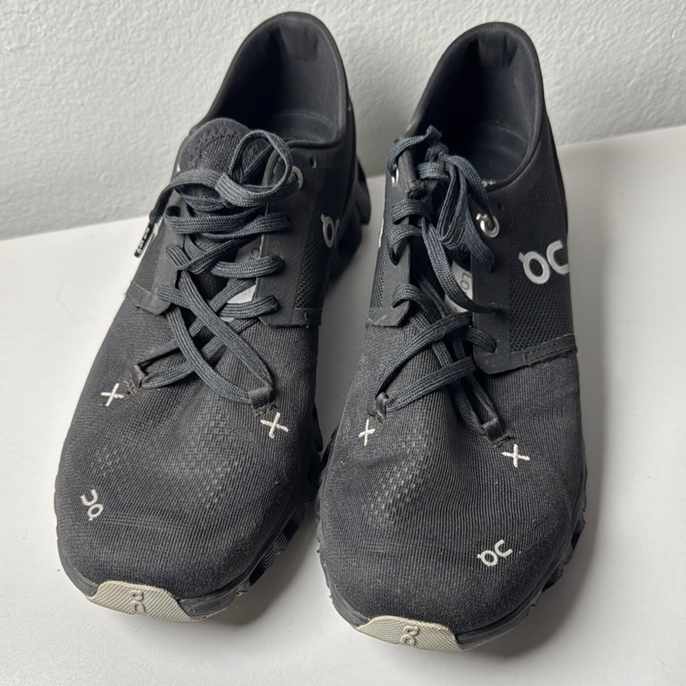On Running Black Athletic Shoes with Star Design